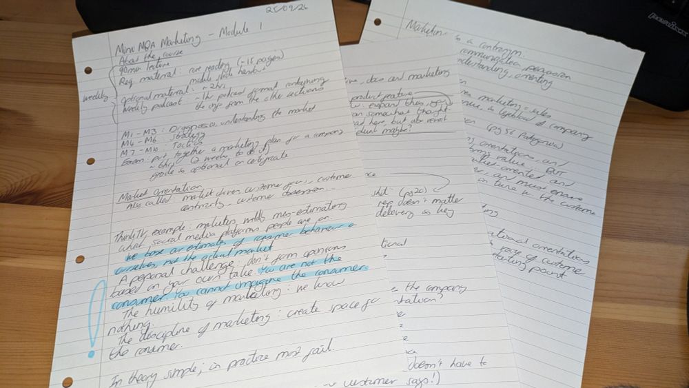 Photograph of three pages of handwritten lecture notes.