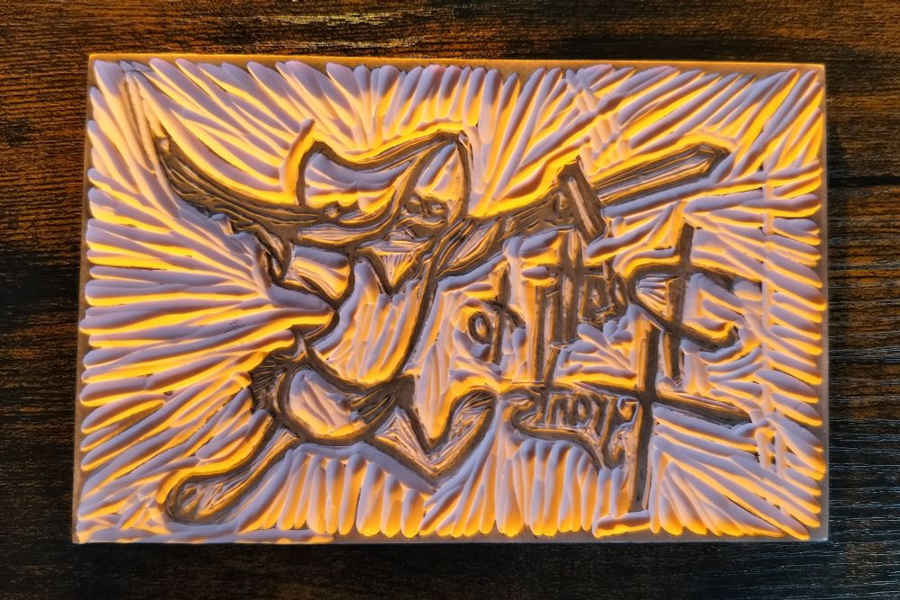 A linocut block depicting Skippy from Disney's Robin Hood with the reverse text "Death to Tyrants," referencing the quote the young rabbit uses in defiance to Prince John