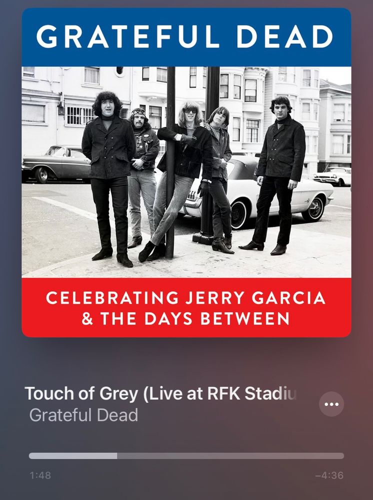 A screenshot of the Apple Music mobile UI. The song is Touch of Grey by the Grateful Dead. The album art is a photo of the Grateful Dead dated sometime in the sixties.
The song is live at RFK Stadium, Washington DC 7/12/89.
