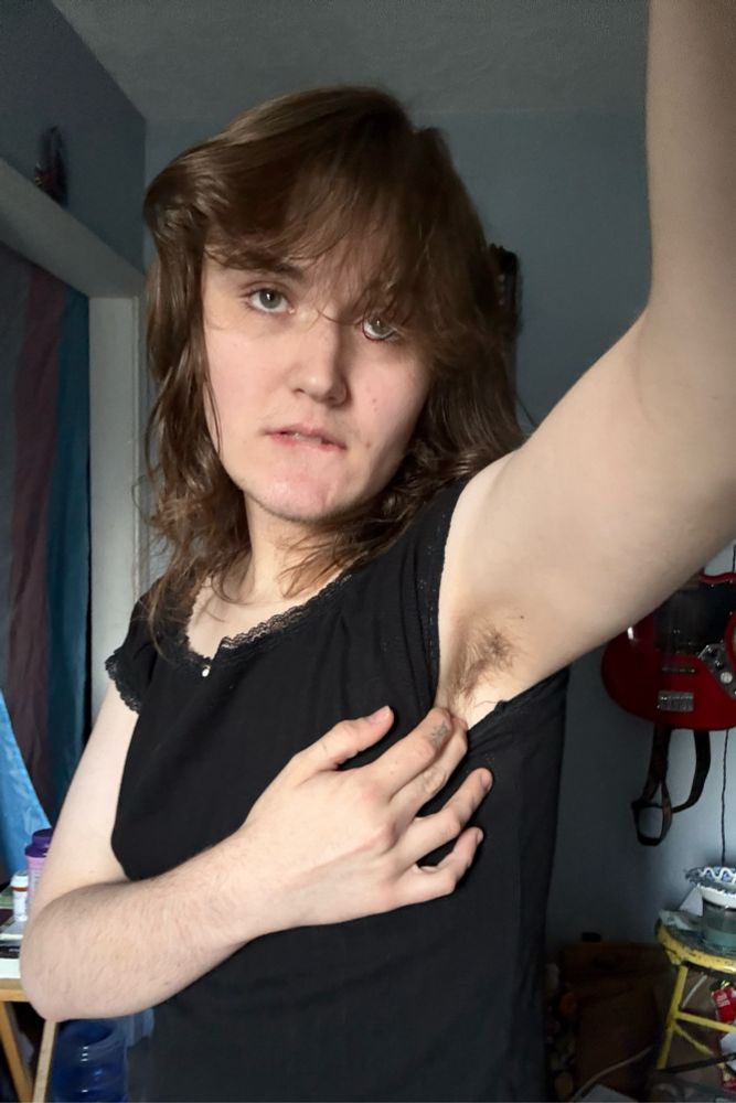 i’m standing in my black tank top and showing off my stinky girl armpits