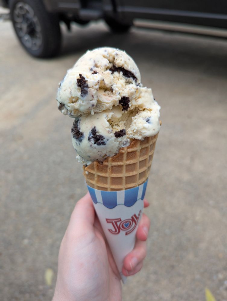 A cookies and cream ice cream cone