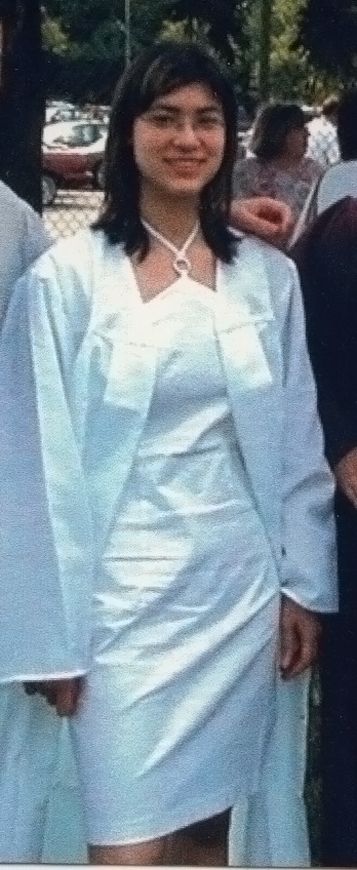 Teenage me wearing an open white graduation robe and a white halter-top dress that resembles Rinoa's dress from FF8's ballroom scene