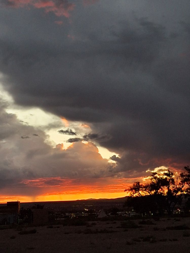 Fiery orange underside to the western clouds after sunset. 