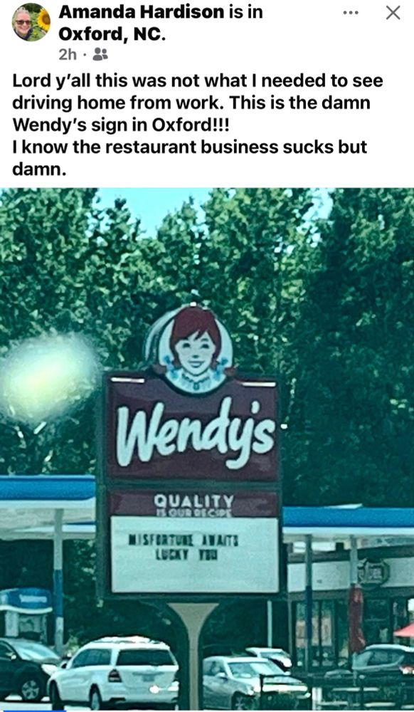 A Wendy’s sign in Oxford NC that reads Misfortune Awaits Lucky You
