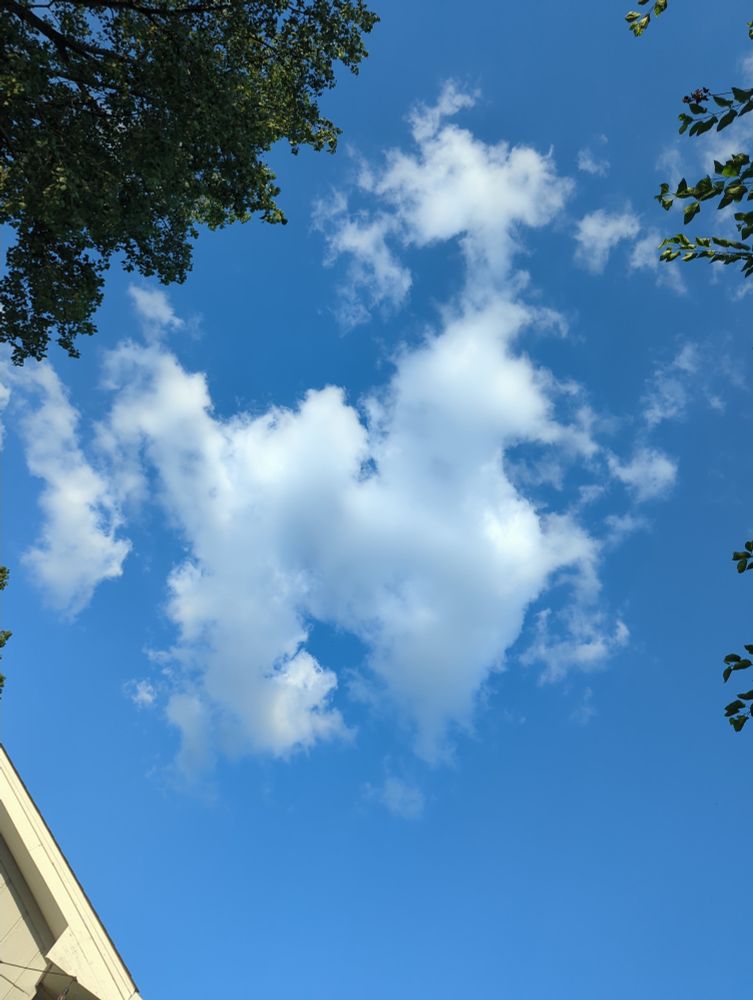 A blue sky with a cloud