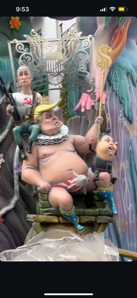 Fallas ninot sculpture with caricature of Trump, flanked by Putin and a baby president Elon musk. 