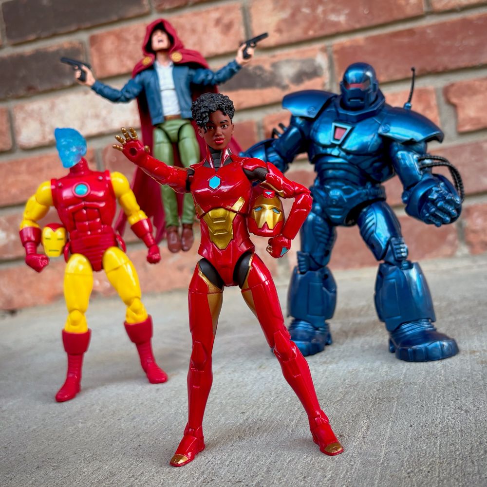 This photo features Marvel Legends figures of Hologram Tony Stark AKA Iron Man, Park Robbins AKA The Hood, Riri Williams AKA Iron Heart, and Obadiah Stane AKA Iron Monger. All figures by Hasbro.