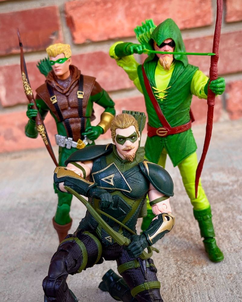 Green Arrow collectible figures from McFarlane Toys. Left to right: Connor Hawke Green Arrow, Injustice 2 Green Arrow (first release), Longbow Hunters Green Arrow. 