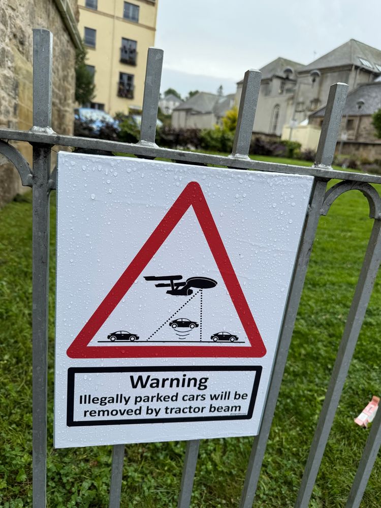 Warning: Illegally Parked Cars Will be removed by tractor beam. 