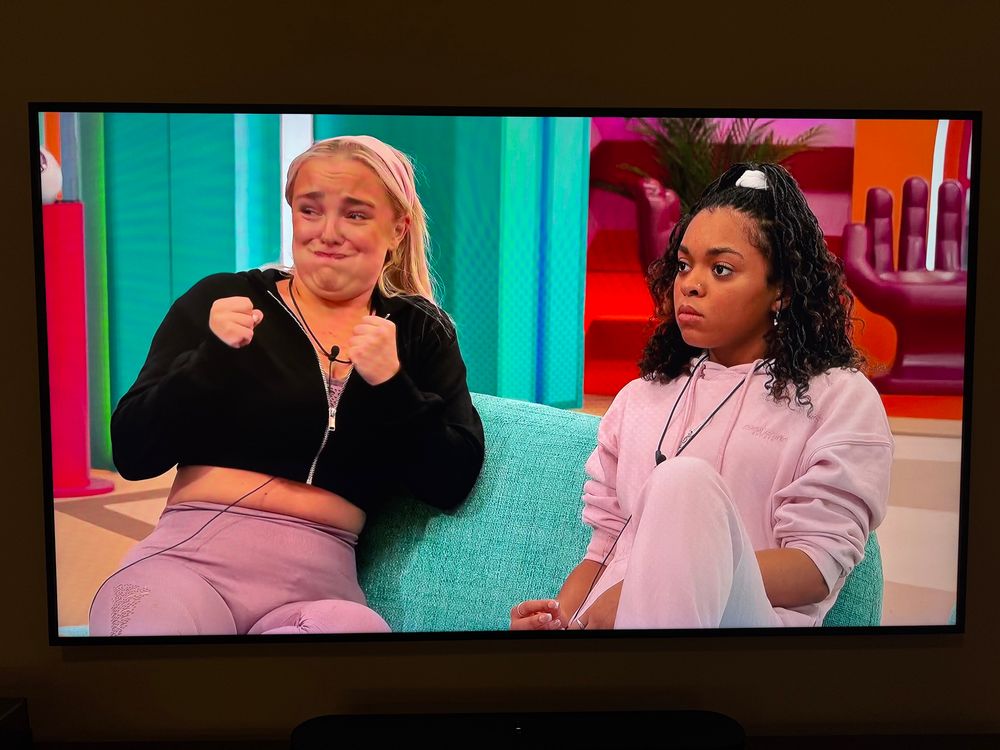 Emily making a stupid face as she watches Jenny balancing the ball.