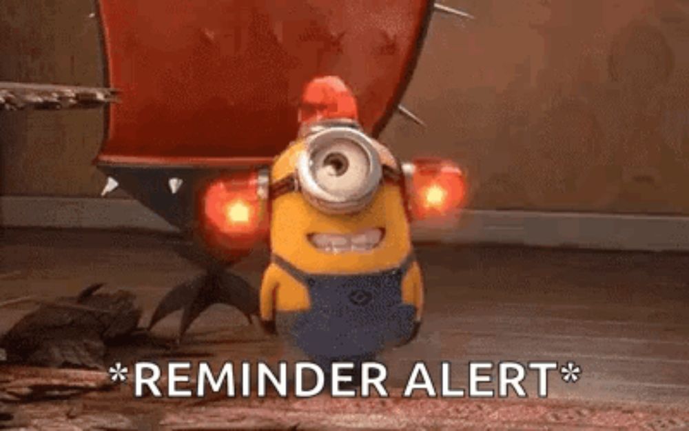 a minion from the movie despicable me is standing on a wooden floor with a red light on its head .