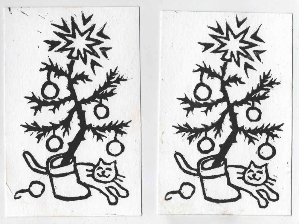 Linocut prints of a scraggly christmas tree in a santa boot. A happy looking cat is under the tree.