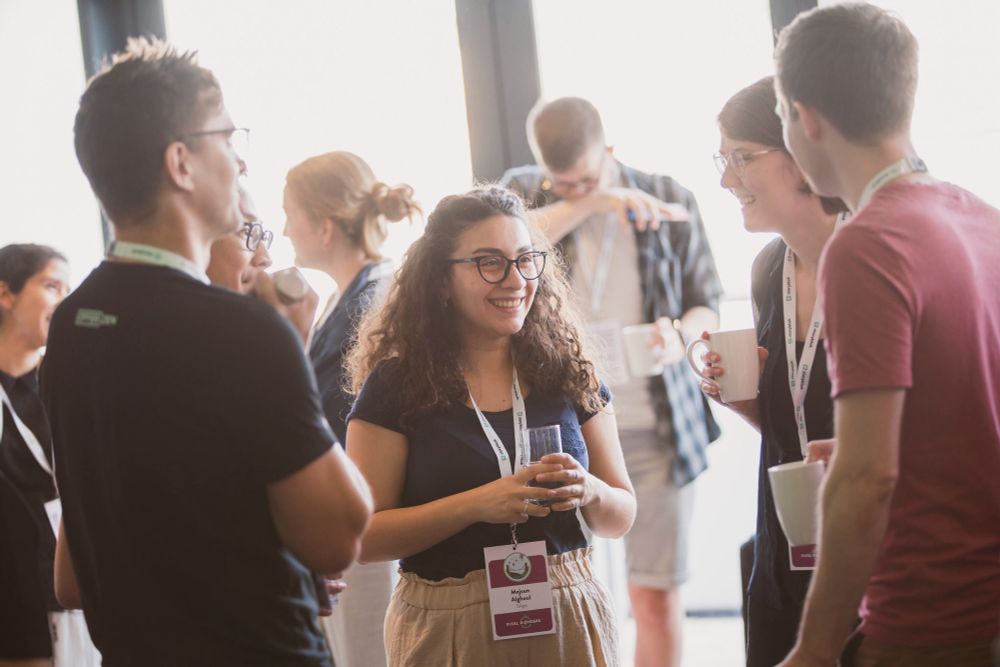 Male and female attendees chatting in one of the breaks at Pixel Pioneers