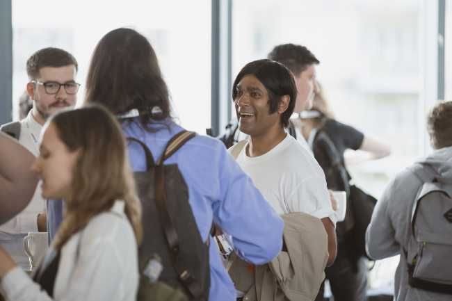 Attendees with different skin colours chatting during a break at Pixel Pioneers