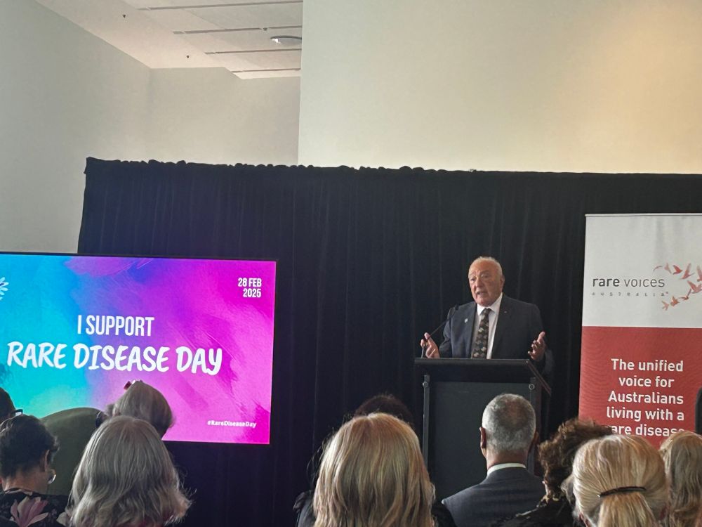 Mike Freelander speaking at rare disease event 