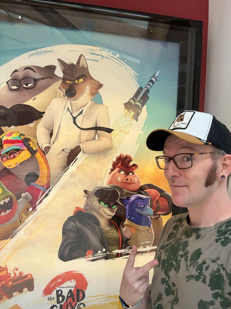 Me in front of the Bad Guys 2 movie poster