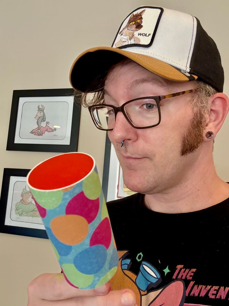Me holding my replica prop for the push pop from The Bad Guys