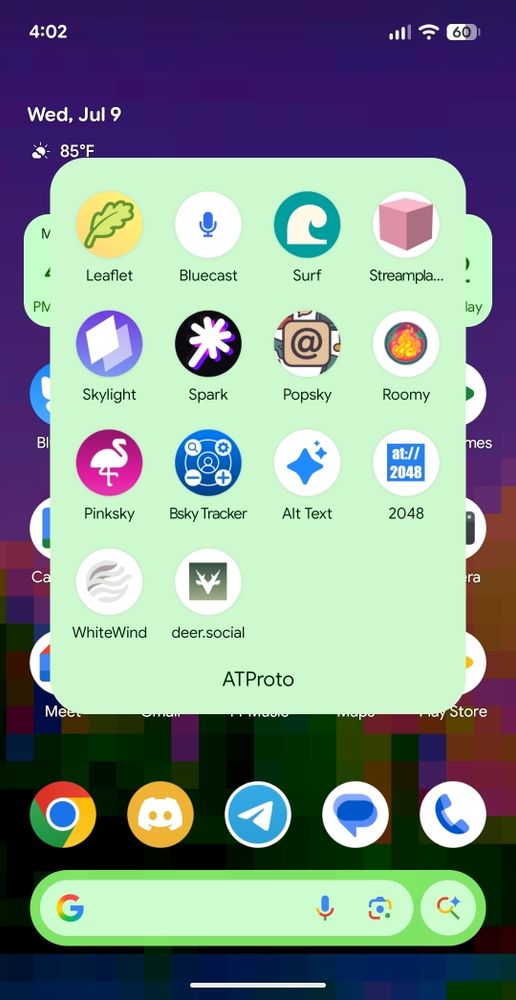 Screenshot of an Android phone home screen showing the time "4:02", date "Wed, Jul 9", and temperature "85°F". A light green app drawer is open, displaying app icons labeled "Leaflet", "Bluecast", "Surf", "Streampla...", "Skylight", "Spark", "Popsky", "Roomy", "Pinksky", "Bsky Tracker", "Alt Text", "2048", "WhiteWind", "deer.social", and "ATProto". The bottom of the screen shows the Google search bar and other app icons.