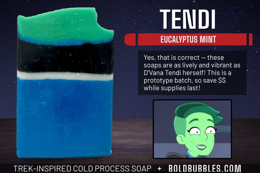 A bar of blue, white, and black soap designed in the Star Trek: Lower Decks-style uniform. At the top is a layer of green for D'Vana Tendi's hair. The scent is eucalyptus mint.