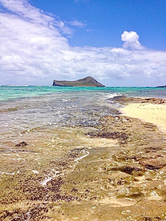 A small island off of Oahu , blue ocean, blue sky 