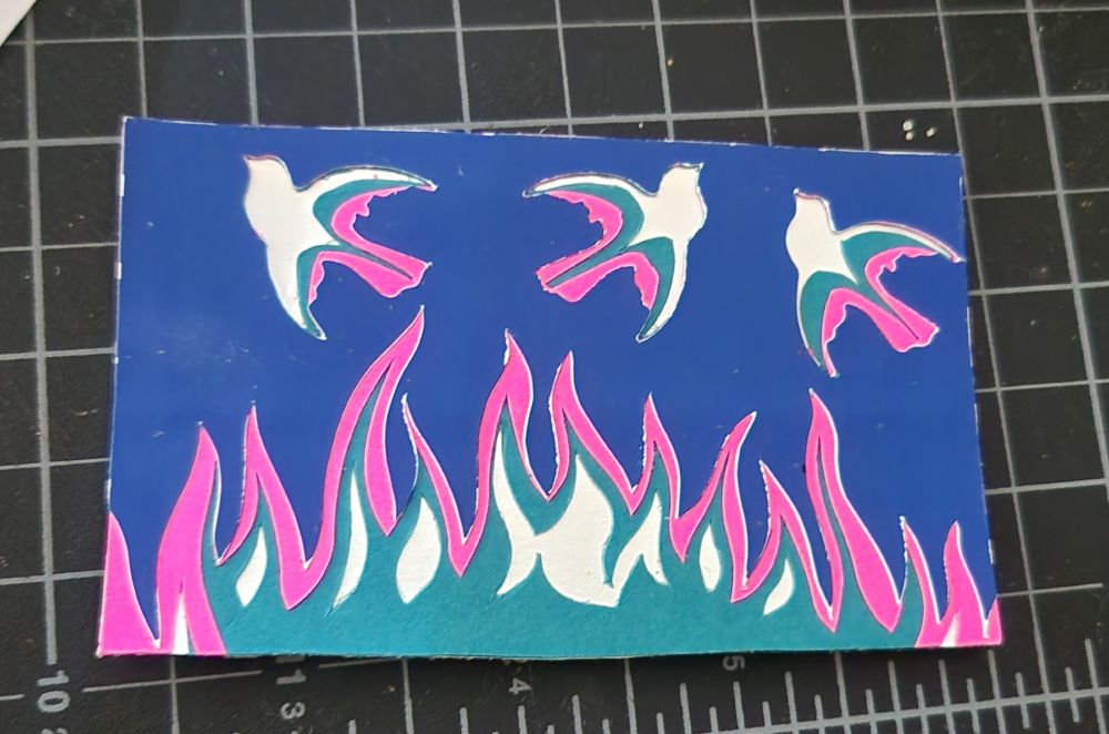 Collage, three birds above fire in blue, teal, and pink