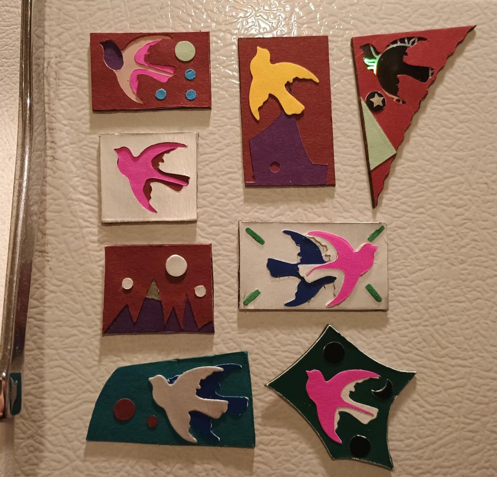 8 small bird themed and one mountain magnets
