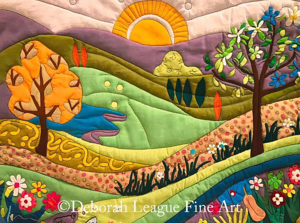 This vibrant digital art depicts a whimsical landscape bursting with color and life. Giving the appearance of being crafted from richly textured fabric, the quilt features rolling hills in purples and greens, a radiant sun rising over the mountains, and two prominent trees. A winding stream, blooming flowers, and abstract foliage add dimension and playfulness. Perfect for lovers of fiber art, quilting, and nature-inspired home decor.