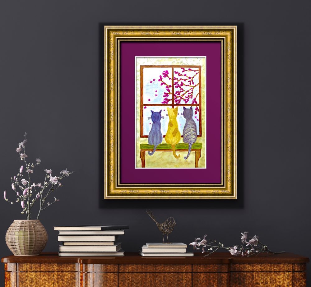Framed art shown in a display room.