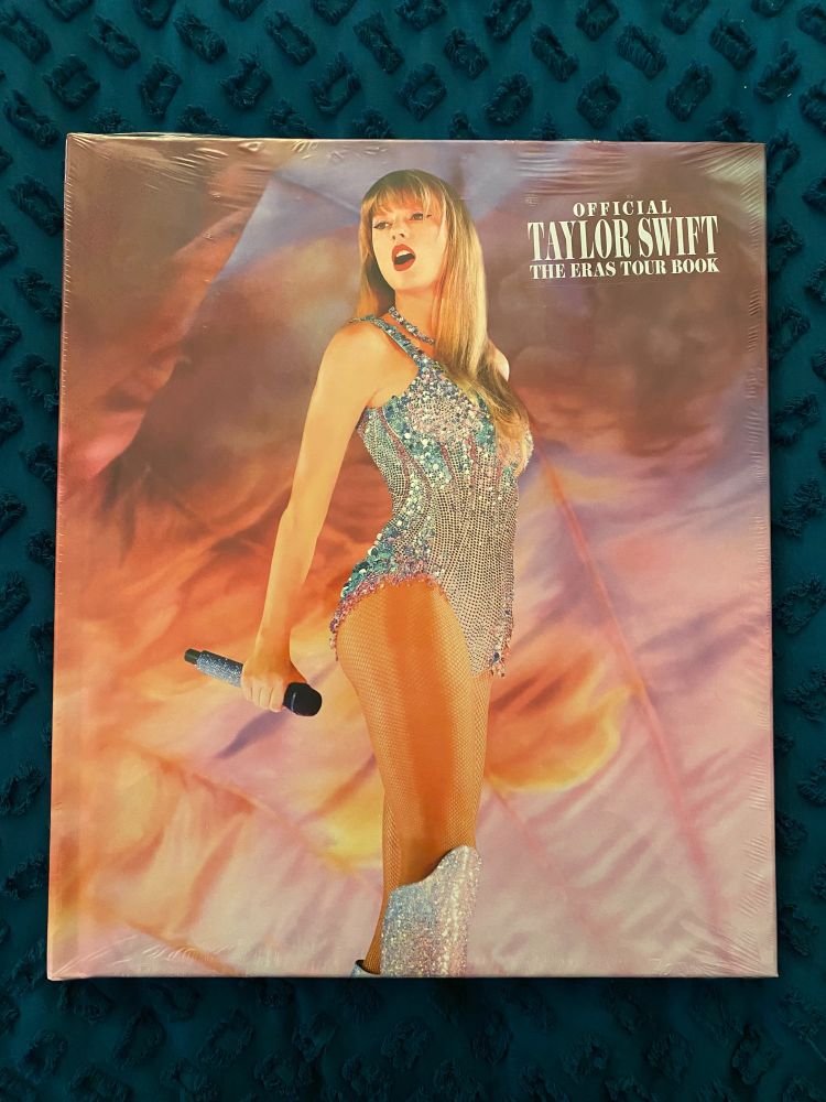 Cover of The Official Taylor Swift The Eras Tour Book.