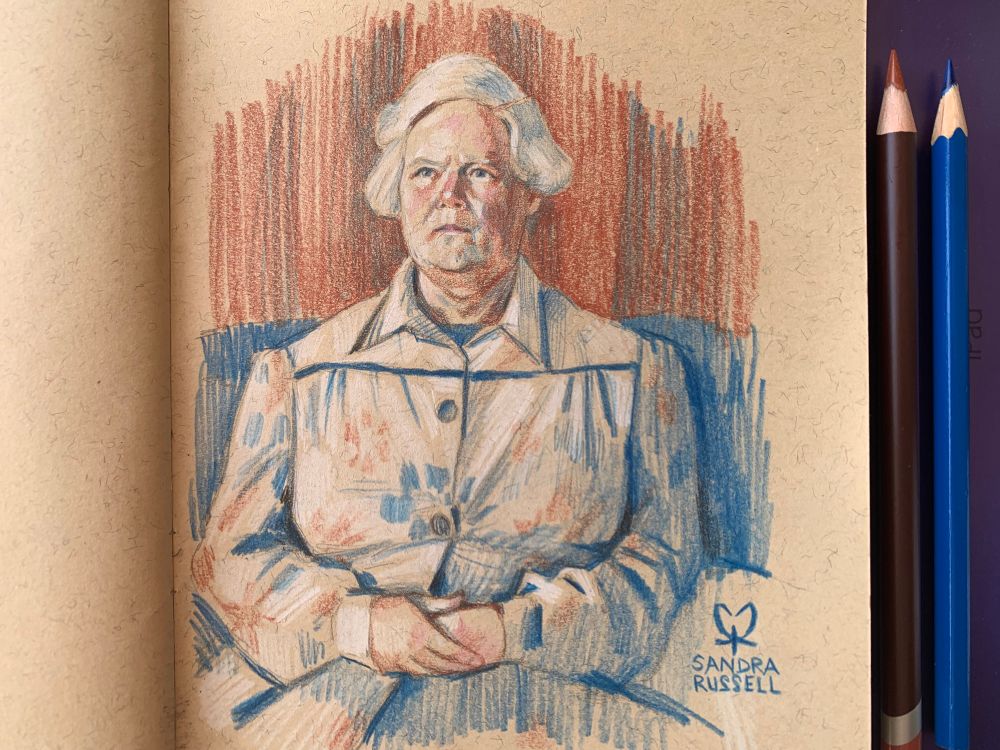 Sandra Russell art coloured pencil sketch on brown recycled paper of a woman’s portrait sitting and holding her hands together. On the right are two coloured pencils.