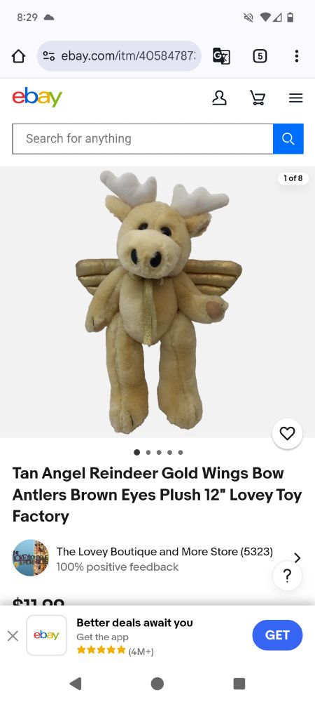A beige stuffed mooseish creature with gold wings... technically a peryton?