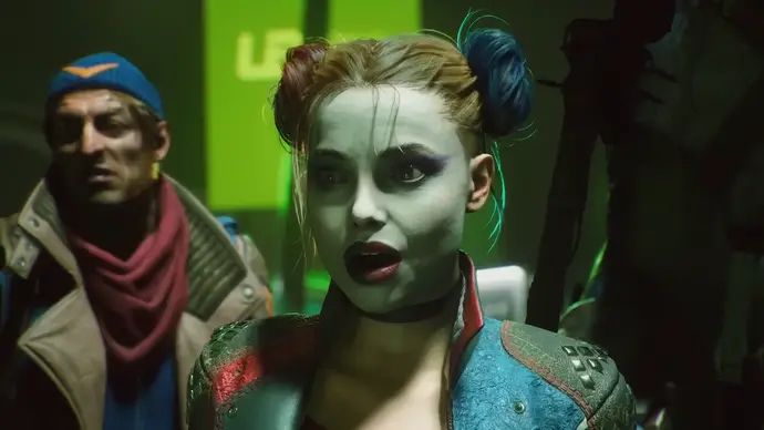 Suicide Squad trailer screenshot showing close up of white-faced Harley Quinn looking surprised