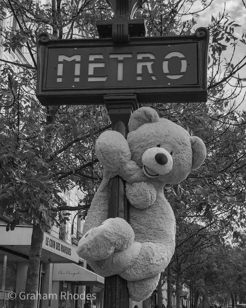 Teddy bear climbing a metro post, Quartier des Gobelins, Paris