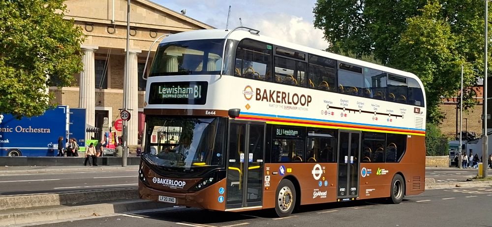 A white and brown Bakerloop livery at bus stand in Waterloo. 