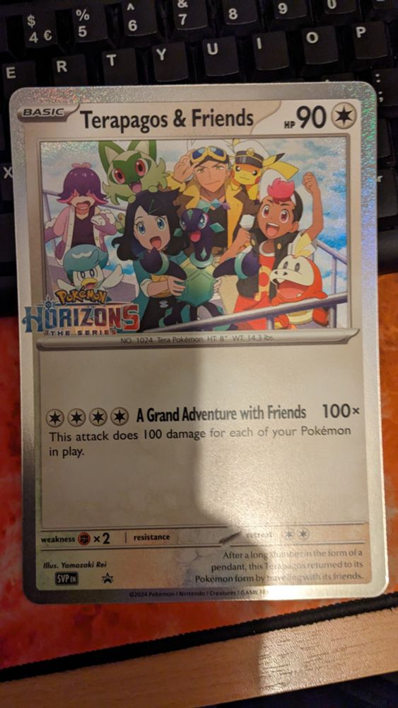 Promotional Pokémon Card "Terapagos & Friends". It is a very large card physically.