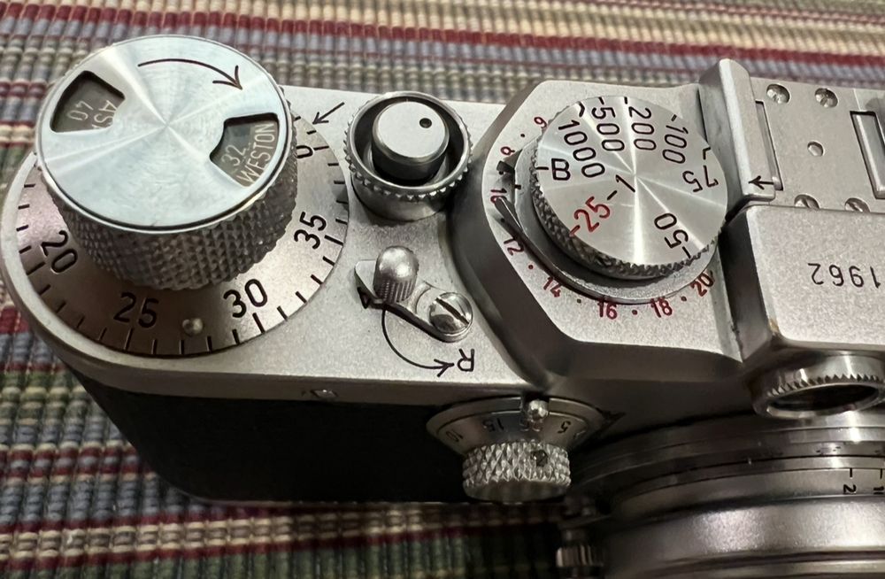Frame counter (top left) and shutter speed dials (top right: high speeds; front dial: low speeds) on a 1952 Leica iiif. 