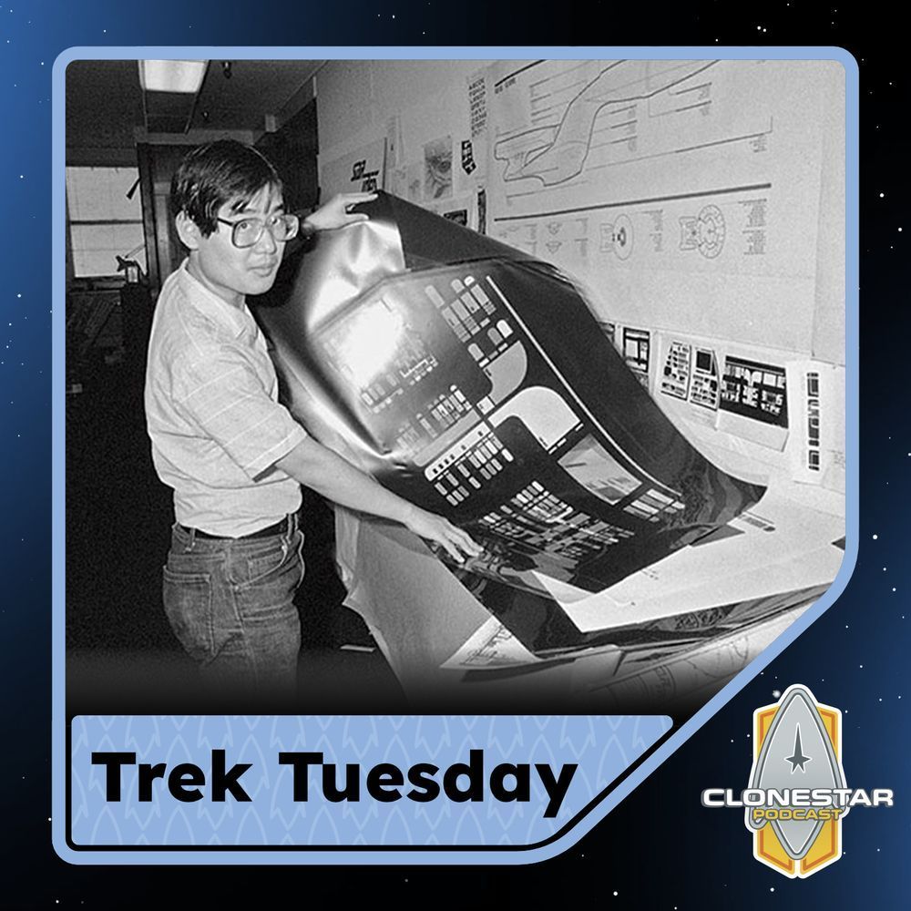 The image is a black-and-white photograph of a person standing in an indoor setting, holding a large printed schematic or poster with intricate designs that appear to be related to technical plans or controls. The person is wearing glasses and a short-sleeved shirt, and they are focused on the large printout they are handling. The environment appears to be an office or workspace, with several smaller printouts and technical diagrams arranged on the wall and surface around them. The image has a blue border with a subtle pattern, and the background is designed with a starry space theme. In the bottom left corner, there is a label “Trek Tuesday,” and in the bottom right corner, there is a logo for “CLONESTAR Podcast.”

Alt-text:

Person holding a large schematic in an office-like setting with technical diagrams on the walls, featuring Trek Tuesday text and CLONESTAR Podcast logo.

Transcribed Text:

Trek Tuesday CLONESTAR Podcast