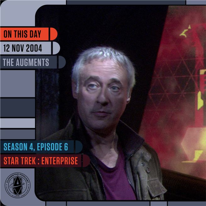 A man with short gray hair and a serious expression stands in dim lighting, illuminated by the red and yellow glow of a futuristic display behind him. He wears a brown jacket over a dark shirt. The LCARS-style frame reads: “On This Day — 12 Nov 2004 — The Augments” and “Season 4, Episode 6 — Star Trek: Enterprise.” The CloneStar Podcast logo appears in the corner.
