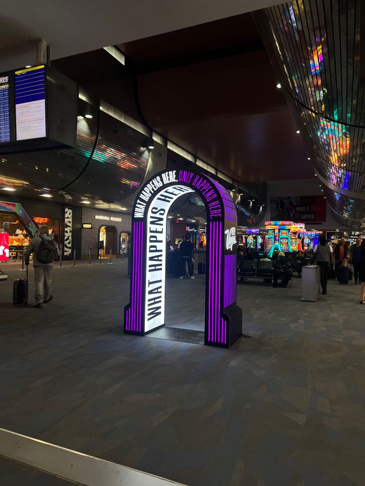 An installation in the Las Vegas airport that reads “What happens here, only happens here”