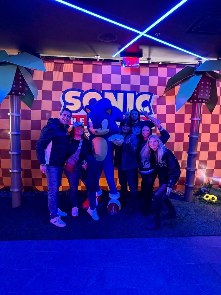 The SEGA team with the Sonic mascot 