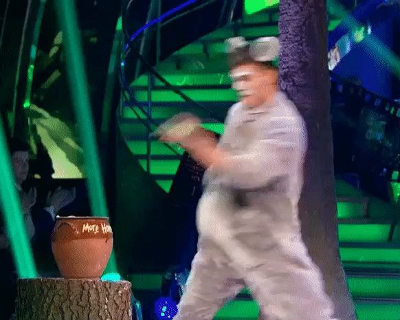 Aljaž in a (long ago) previous routine, dressed as Baloo, sticking his finger in the honey jar and licking it. Yep. 