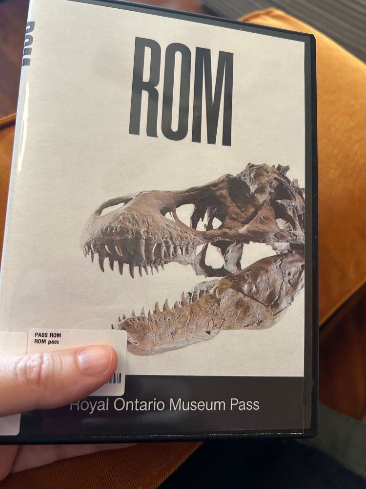 DVD case with skeleton of dinosaur head on the front and the words Royal Ontario Museum Pass at the bottom. 