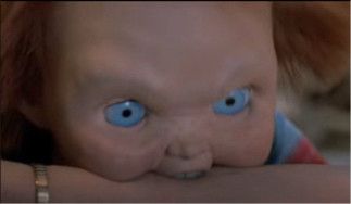 Chucky biting someone’s arm