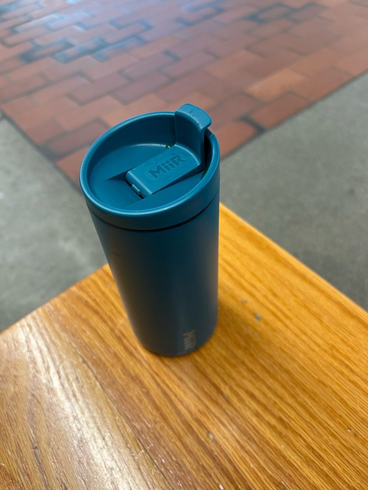 Picture of a green coffee thermos 
