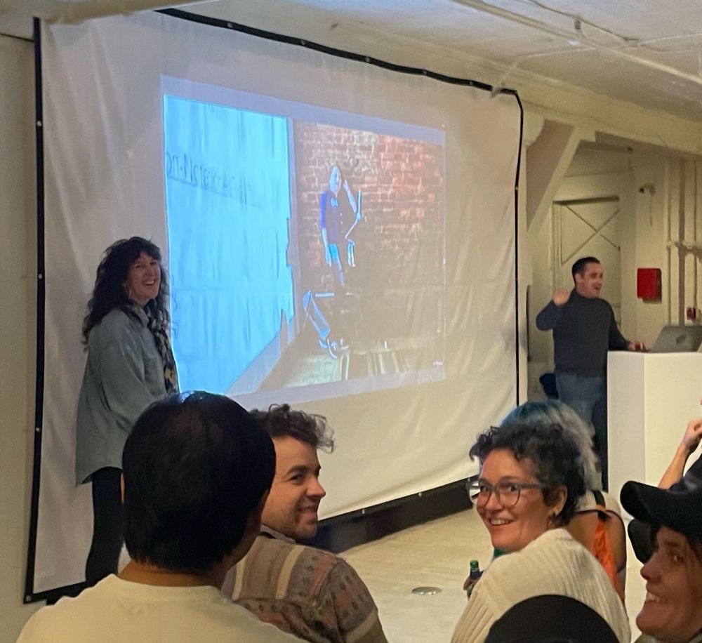 Picture of a slide with me on it being presented 