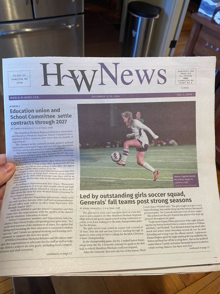 Photo of a newspaper: HW News. Two articles are on the cover and a photo of a high school soccer player.