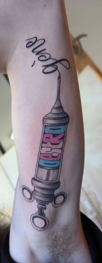 Syringe with the word oestrogen 
Trans flag on the letters tattoo