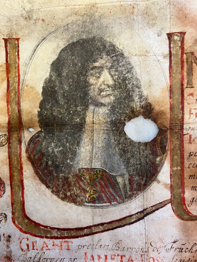 Close-up of a 17th-century engraved and hand-colored portrait of King Charles II - a man with long curly hair and elaborate clothing-, featured in the Gordon family nobility document.