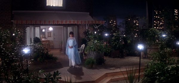 Margot Kidder's breathtaking rooftop apartment in SUPERMAN (1978). She stands looking out over Metropolis at night, wearing a diaphanous white gown, waiting for Superman to visit.