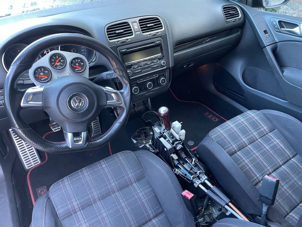 A black mid-engined (!) Mk6 VW GTI